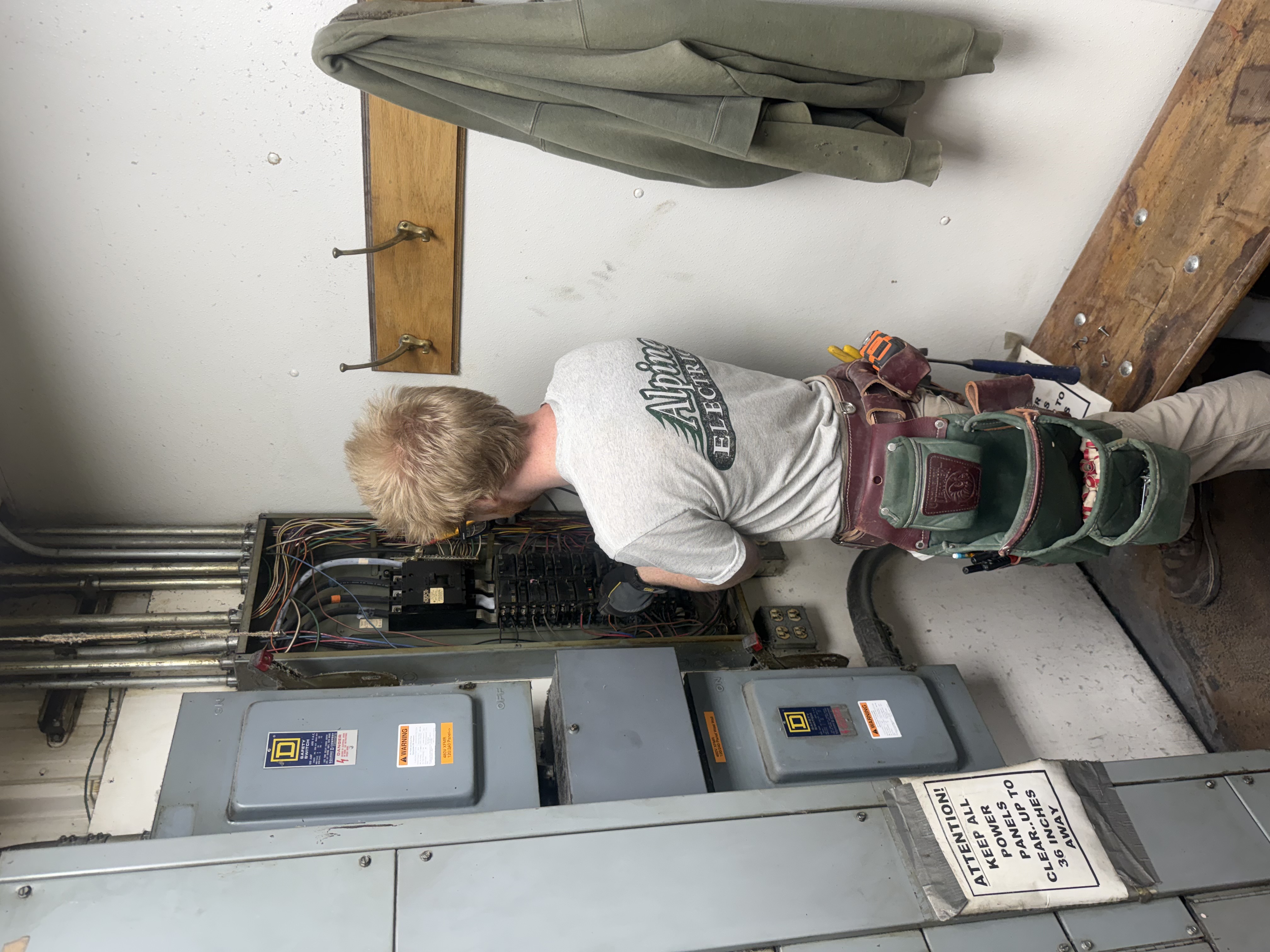 Alpine Electric, LLC working on panel